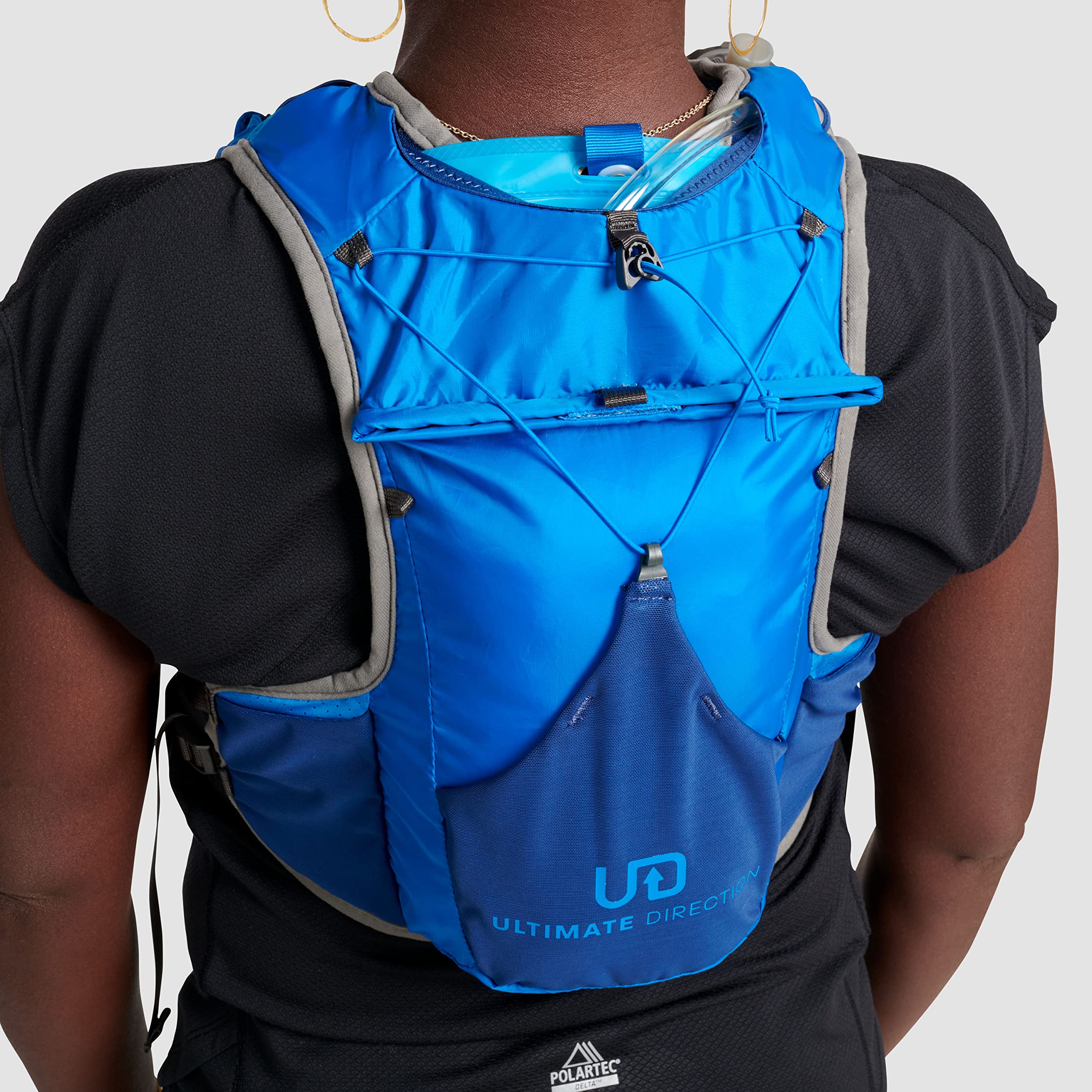 Ultimate Direction Highland Hydration Vest exterior bungees ready to carry a rain shell