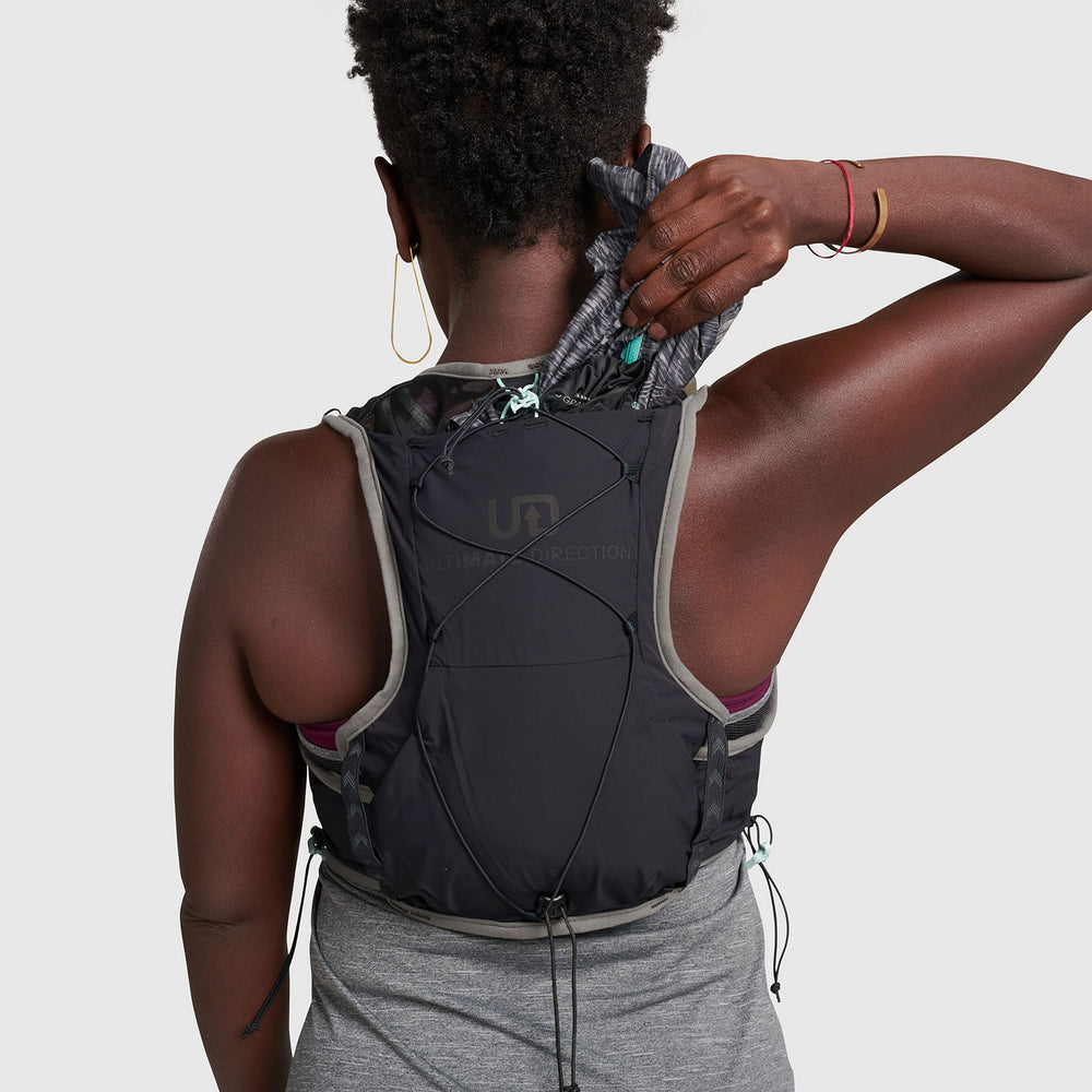 Ultimate Direction Race Vesta 6.0 x-stretch storage pockets hold snacks and glasses.
