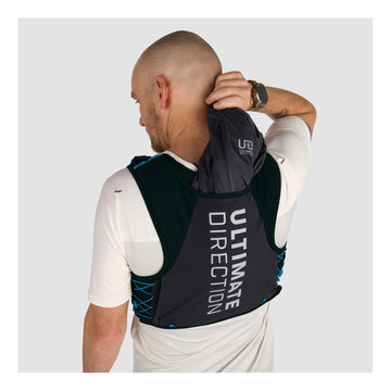 Ultimate Direction Xodus vest back pockets and reservoir sleeve support hydration on varied terrain