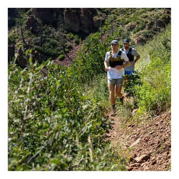 Ultimate Direction Xodus vest trekking pole carry option enables versatile setup on mountain routes.