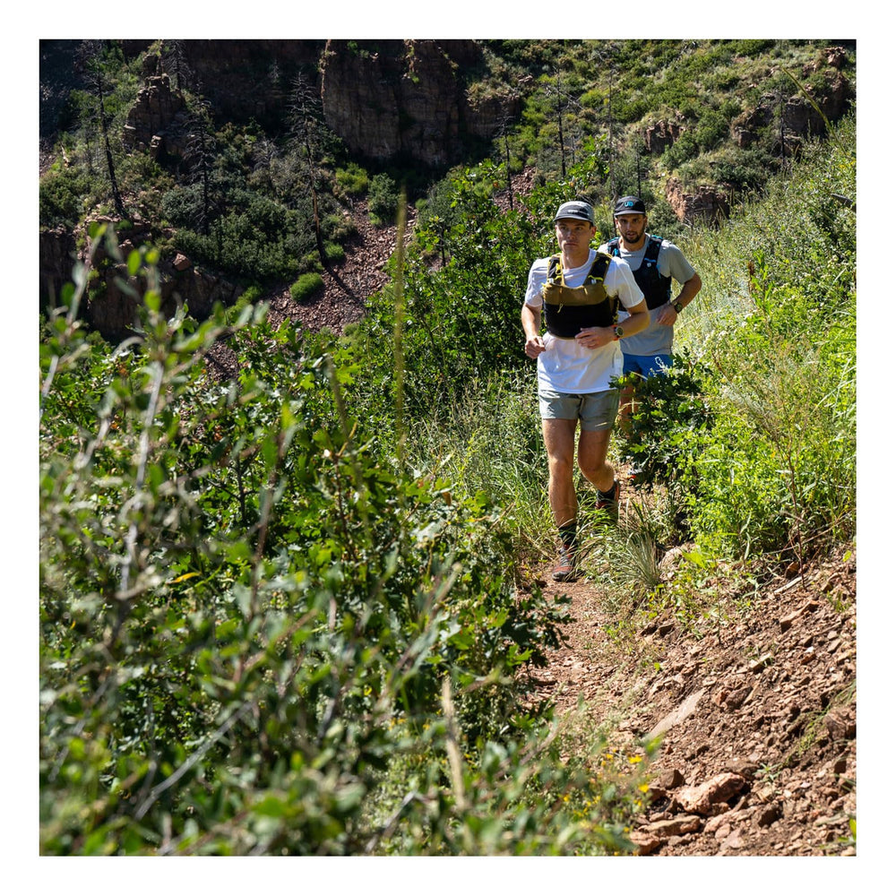 Ultimate Direction Xodus vest trekking pole carry option enables versatile setup on mountain routes.