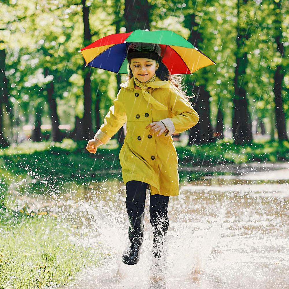 Person gardening while wearing a rainbow umbrella hat