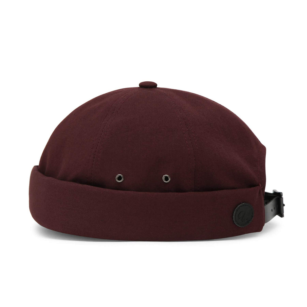 UNDERCONTROL VNTG brimless cap antique brass buckle closeup emphasizes durable vintage hardware.
