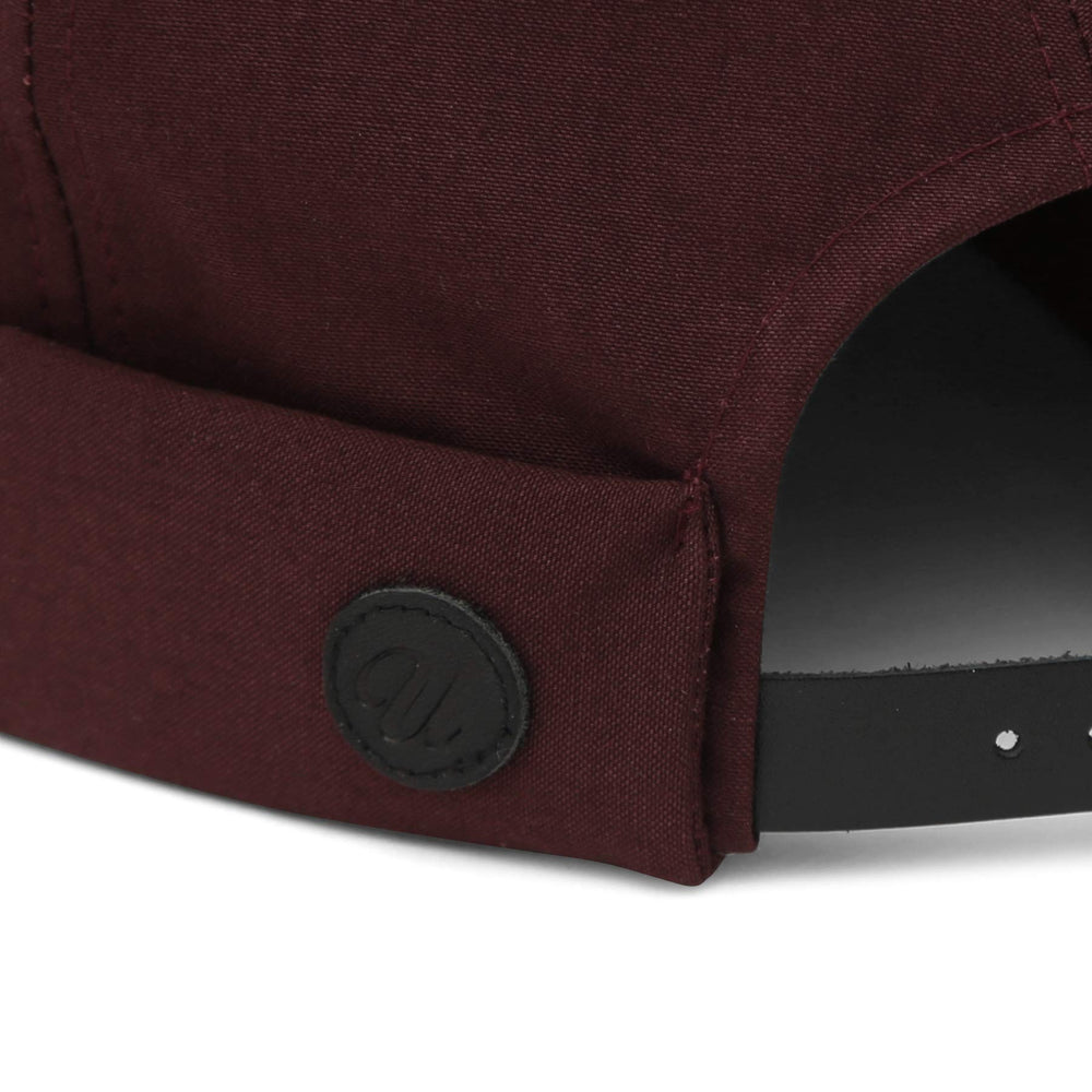 UNDERCONTROL VNTG brimless cap mustard color worn with casual tee and denim.