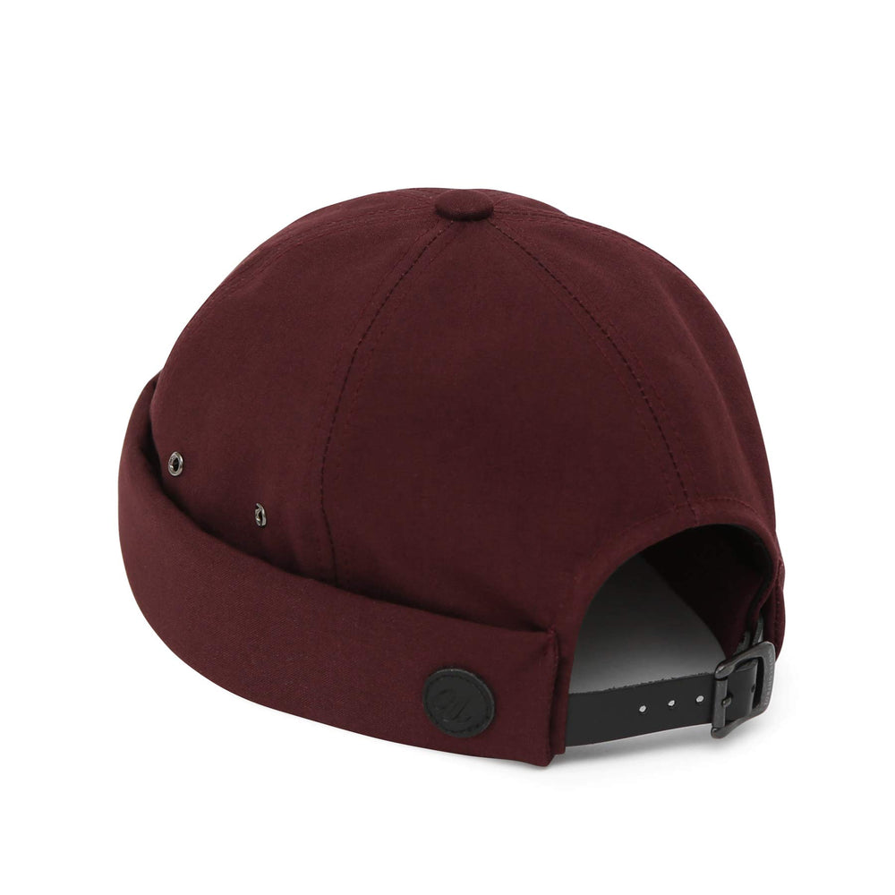 UNDERCONTROL VNTG brimless cap wine color back strap detail shows leather buckle hardware.