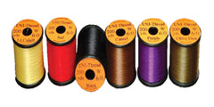 Uni Filter purple waxed thread on spool for smooth, durable fly tying wraps.