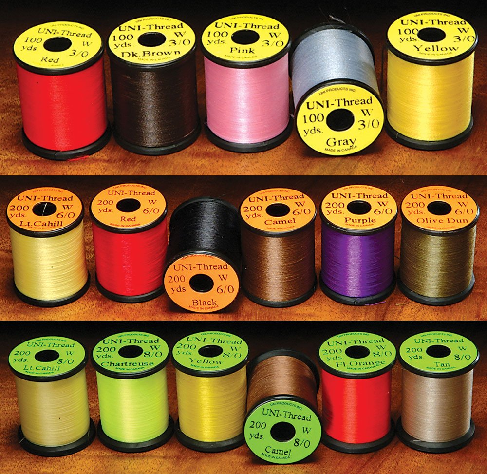 UNI Waxed Thread 3/0 Pink on spool for durable fly tying and smooth lay.