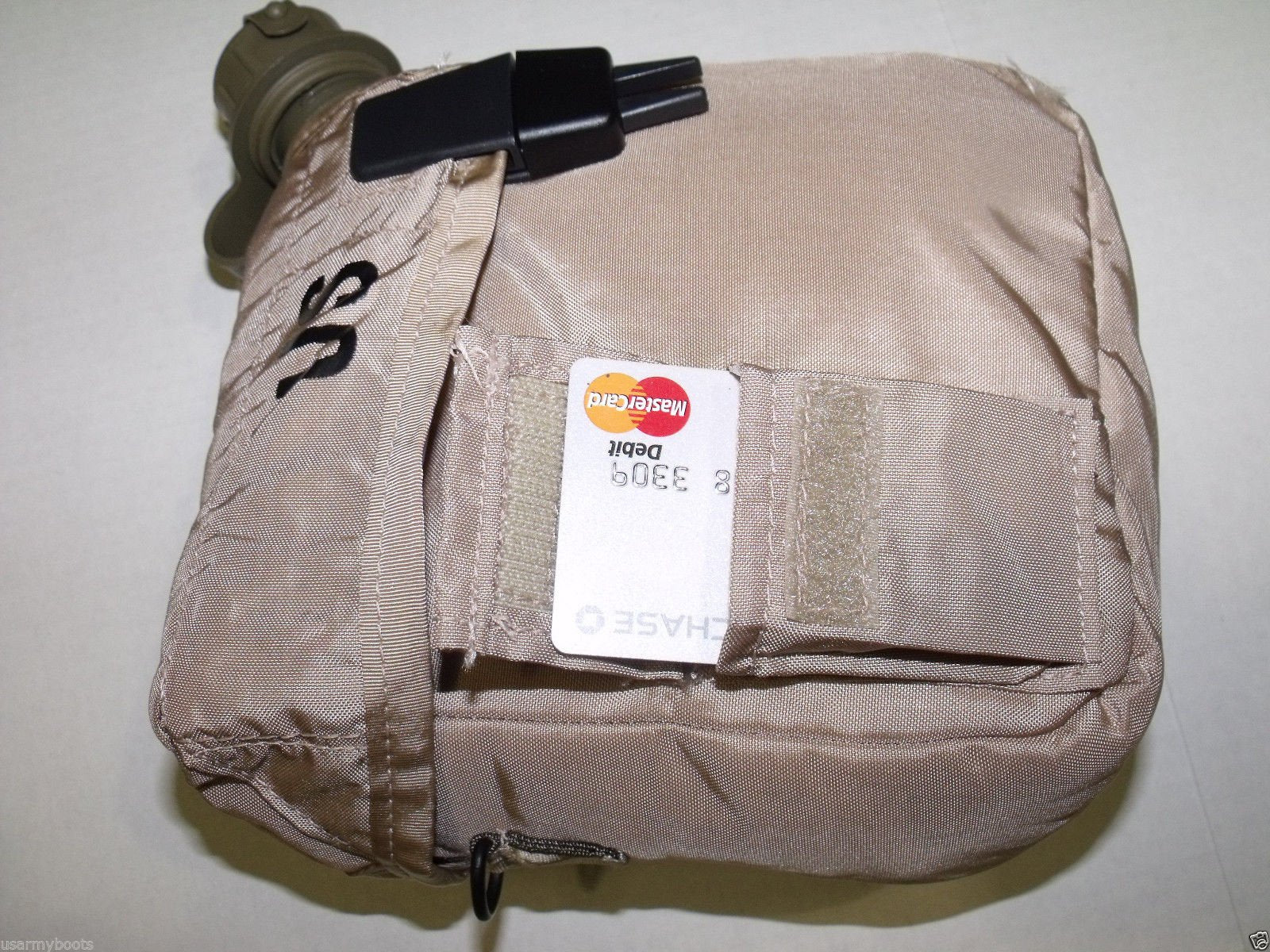 Unicor Desert Tan cover pouch with sling keeps canteen ready at hand.