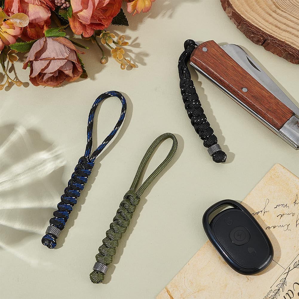 Close-up of UNICRAFTALE paracord knife lanyard assembly showing durable weave.