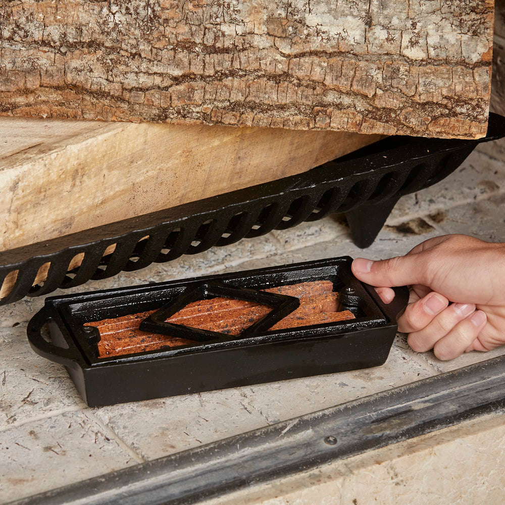 UniFlame Firestarter Tray ideal for backyard fireplaces and outdoor pits.