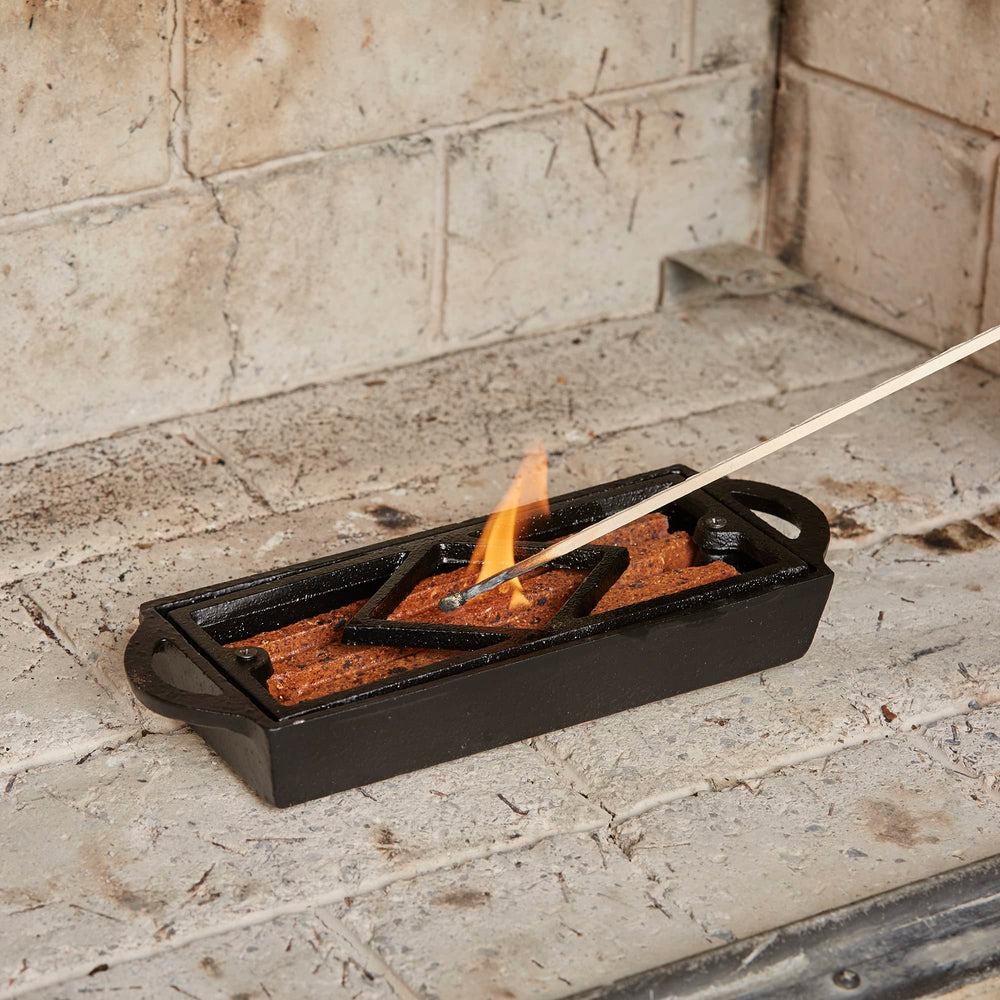 UniFlame Firestarter Tray supports kerosene lighting for quick ignition.