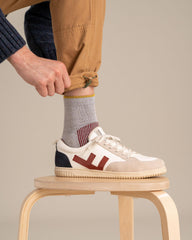 United By Blue Bison Trail Sock red reinforced heel cushion on rugged hikes.