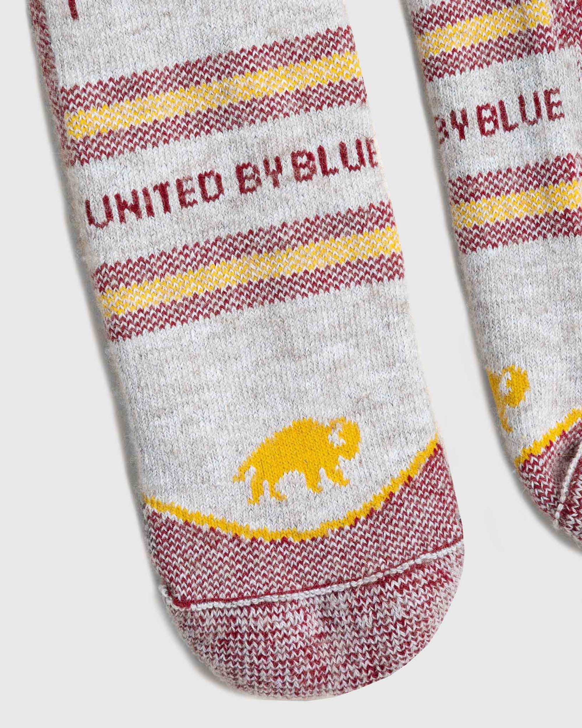 United By Blue Bison Trail Sock red packaging shows low-waste materials.