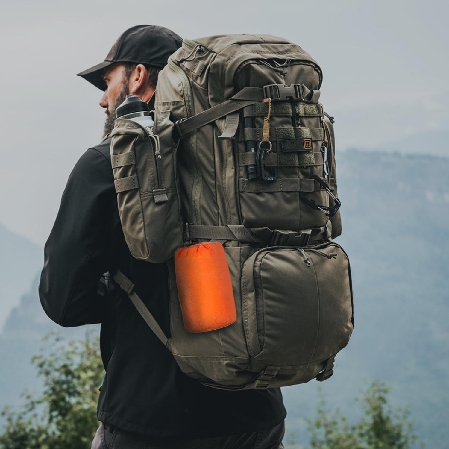 Upneargo emergency sleeping bag features whistle and carabiner for quick signaling and attachment.