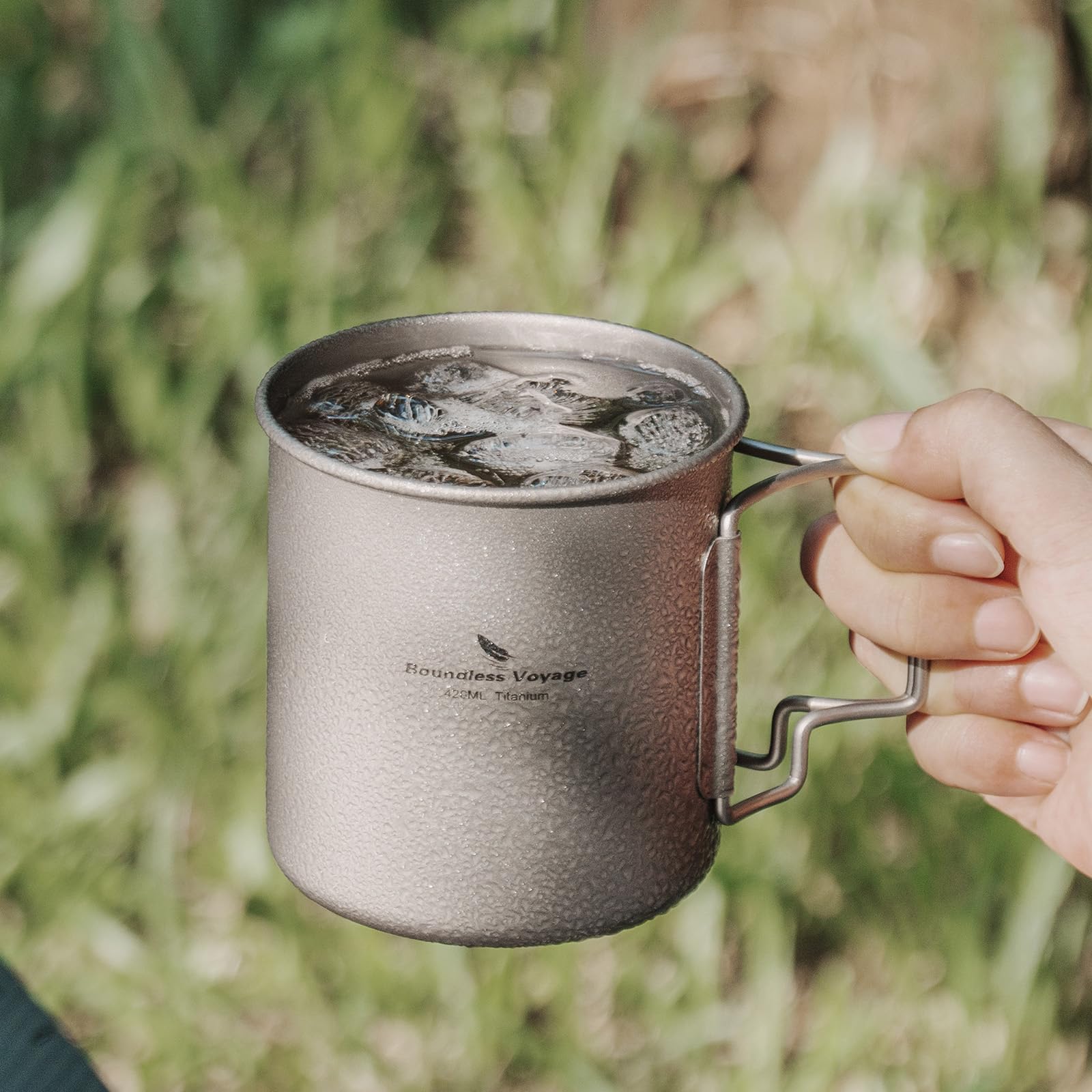 Usharedo titanium mug in camping setup, ready for hot drinks