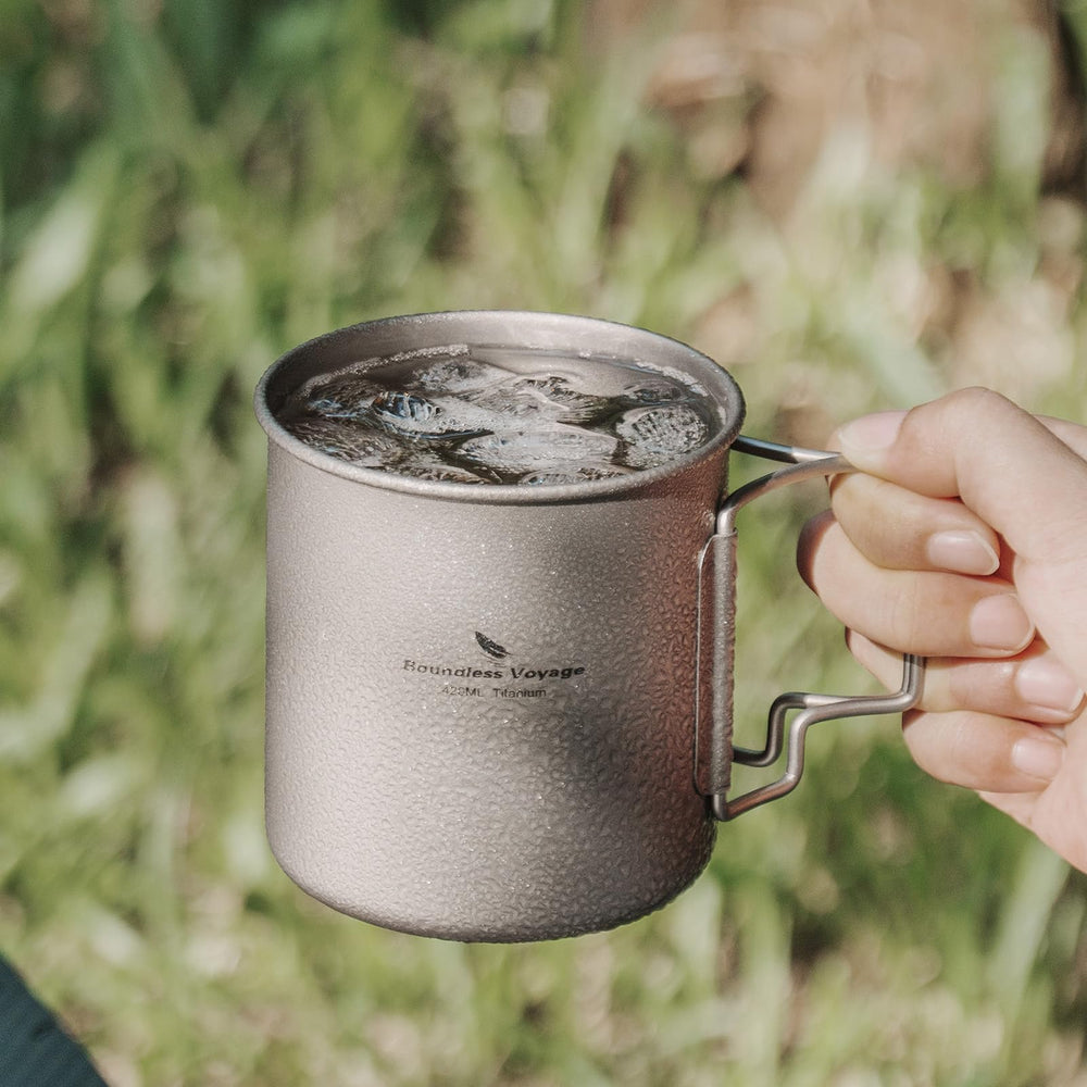 Usharedo titanium mug in camping setup, ready for hot drinks