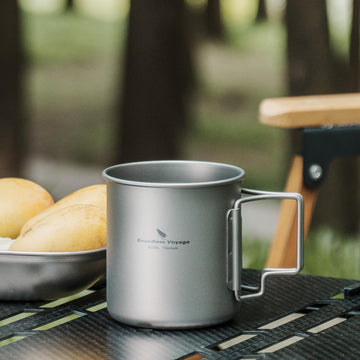 Usharedo titanium mug ready for outdoor adventures with foldable handle