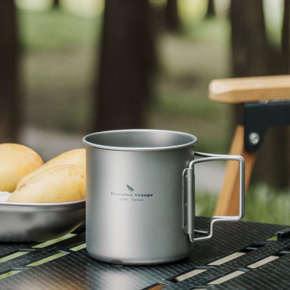 Usharedo titanium mug ready for outdoor adventures with foldable handle