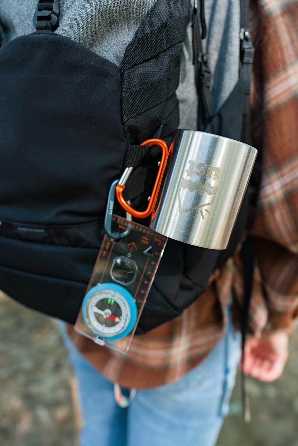 ust KLIPP Biner Mug 1.0 on hiking gear ready for group camping and shared beverages.
