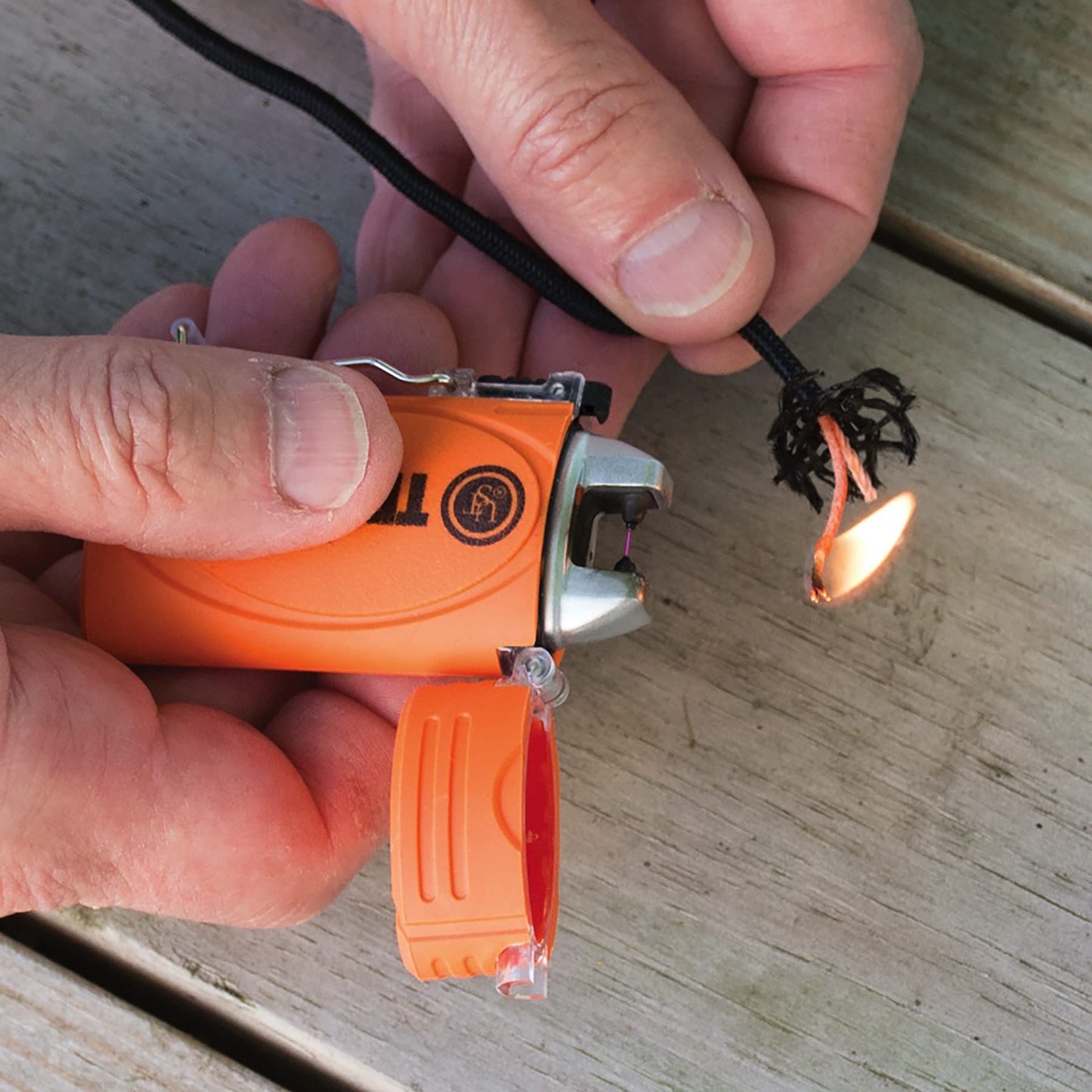 UST TekFire orange rechargeable view highlights USB charging and built-in battery convenience.
