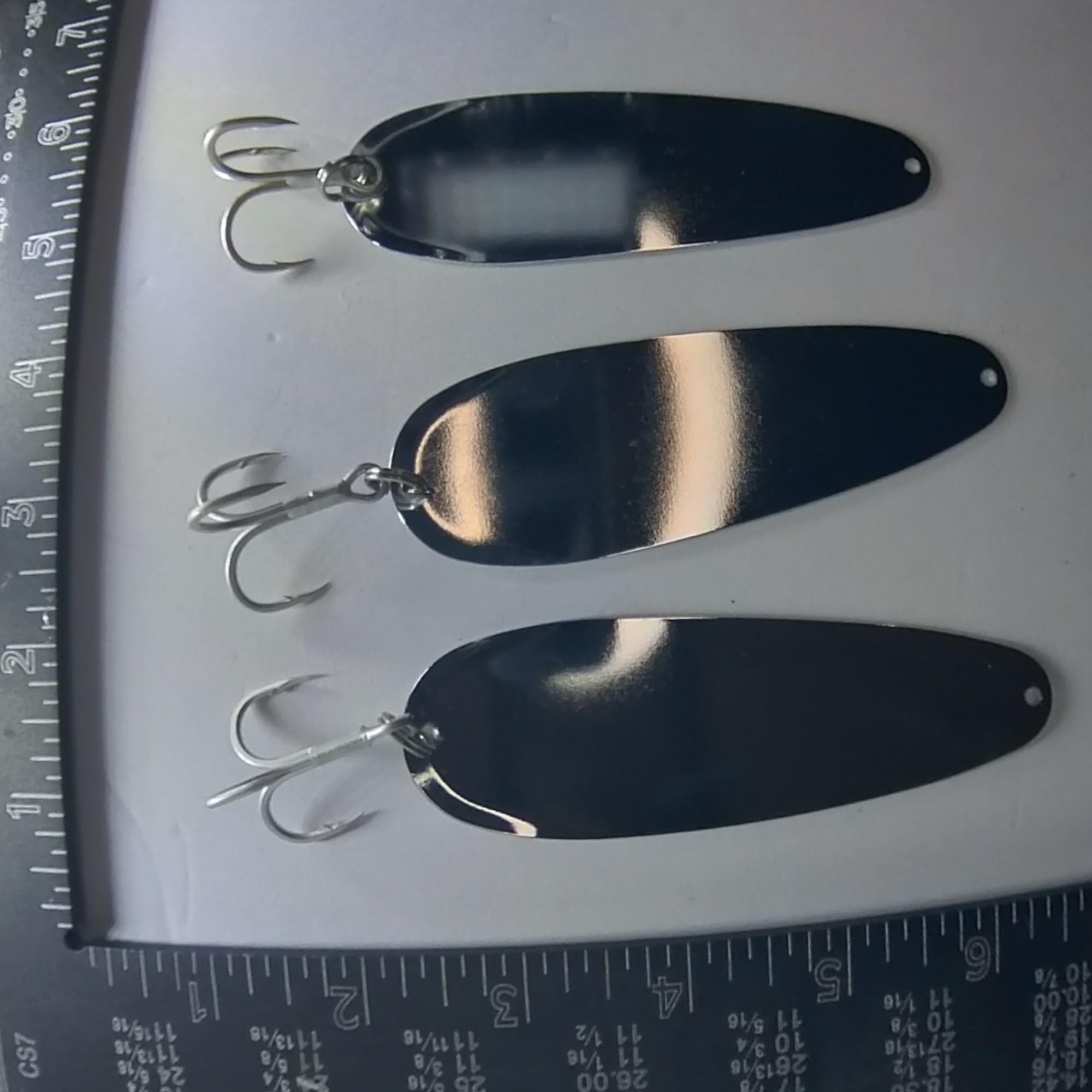 Close-up of reinforced hook and UV & Glow finish on salmon trolling spoon