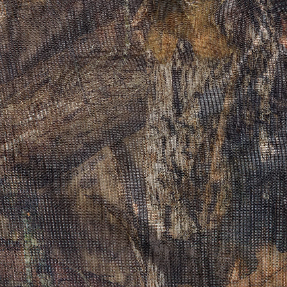 Mossy Oak Break-Up Country camo blends with brush surroundings
