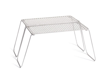 Vargo Titanium Bifold Grill setup over campfire for quick cooking