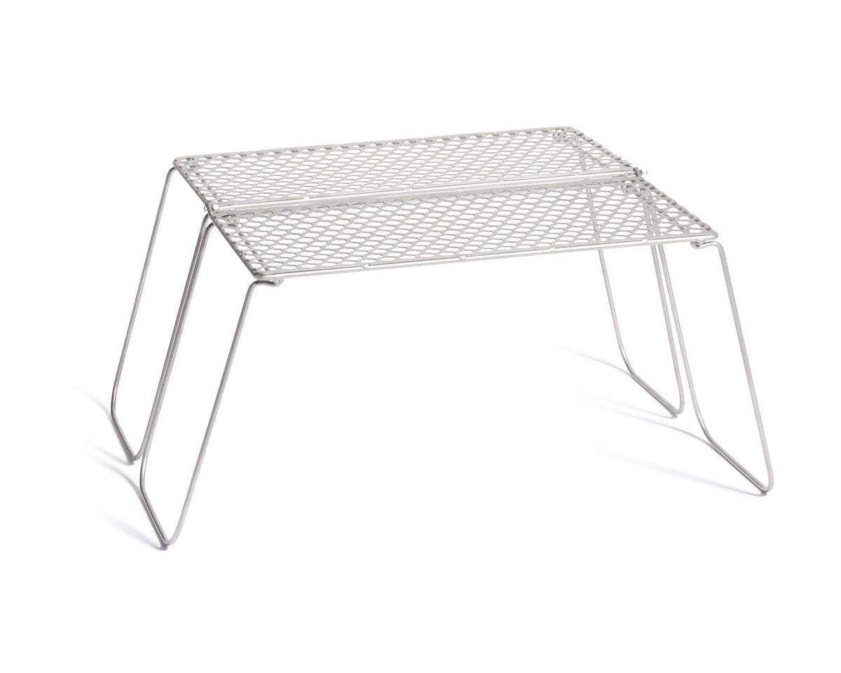 Vargo Titanium Bifold Grill setup over campfire for quick cooking