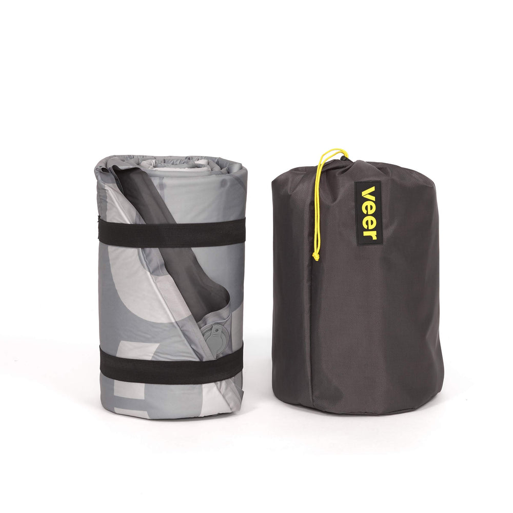 Veer Air Pad folded in storage bag demonstrates portability.