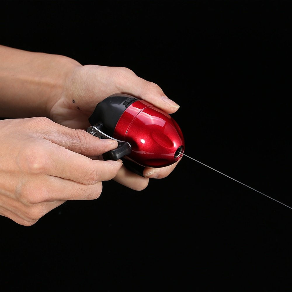 VGEBY Spincast reel angle view highlighting compact form factor.