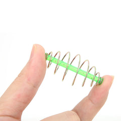 Barrel-shaped metal bait designed for secure bait retention