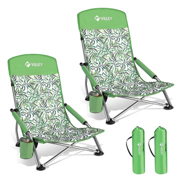 VILLEY low beach chair folded in green tropical leaves pattern for easy transport.