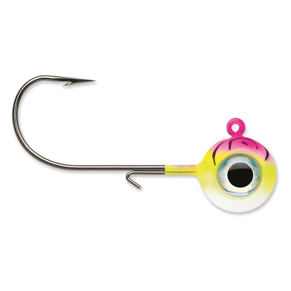 VMC Neon Moon Eye Jig glow in hand for easy lure handling.