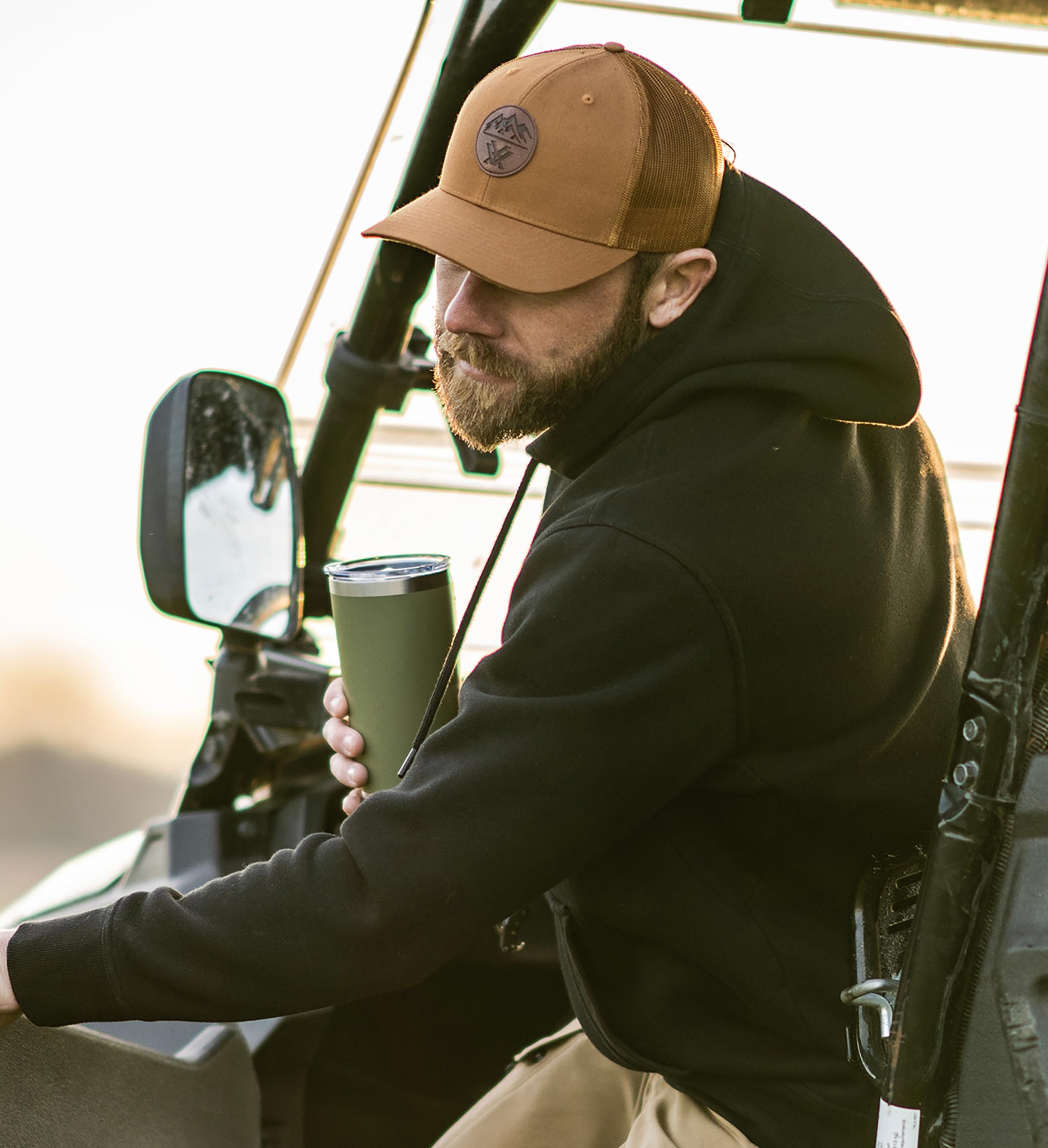 Vortex insulated 20oz tumbler in lichen, lifestyle shot, ideal for outdoor hydration.