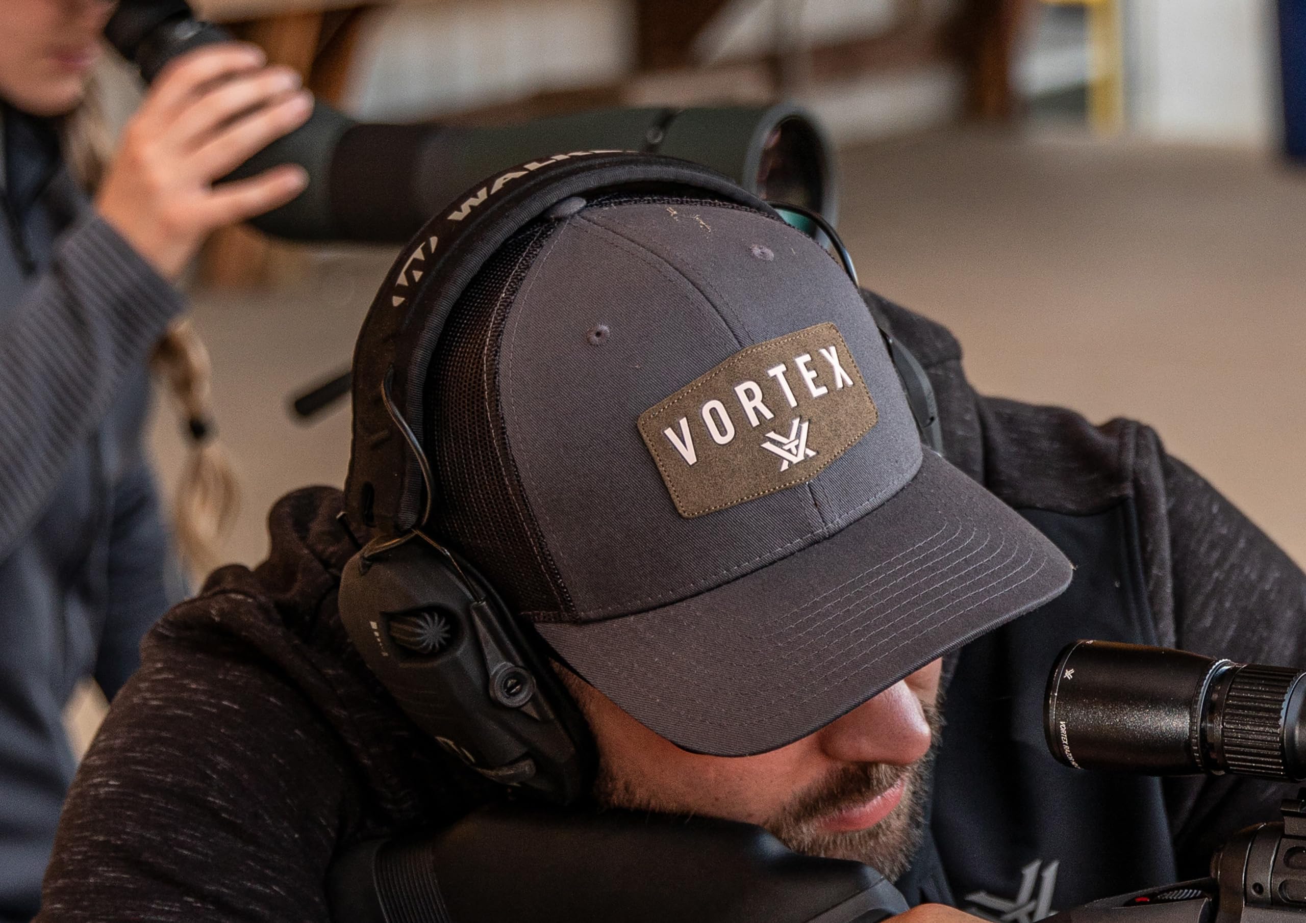 Close-up of Vortex Optics logo on Charcoal Snap Back Cap