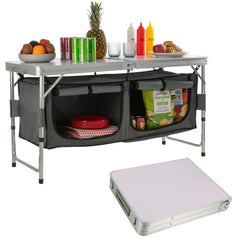 Wakeman folding table with storage shown for beach setup, keeping essentials organized.