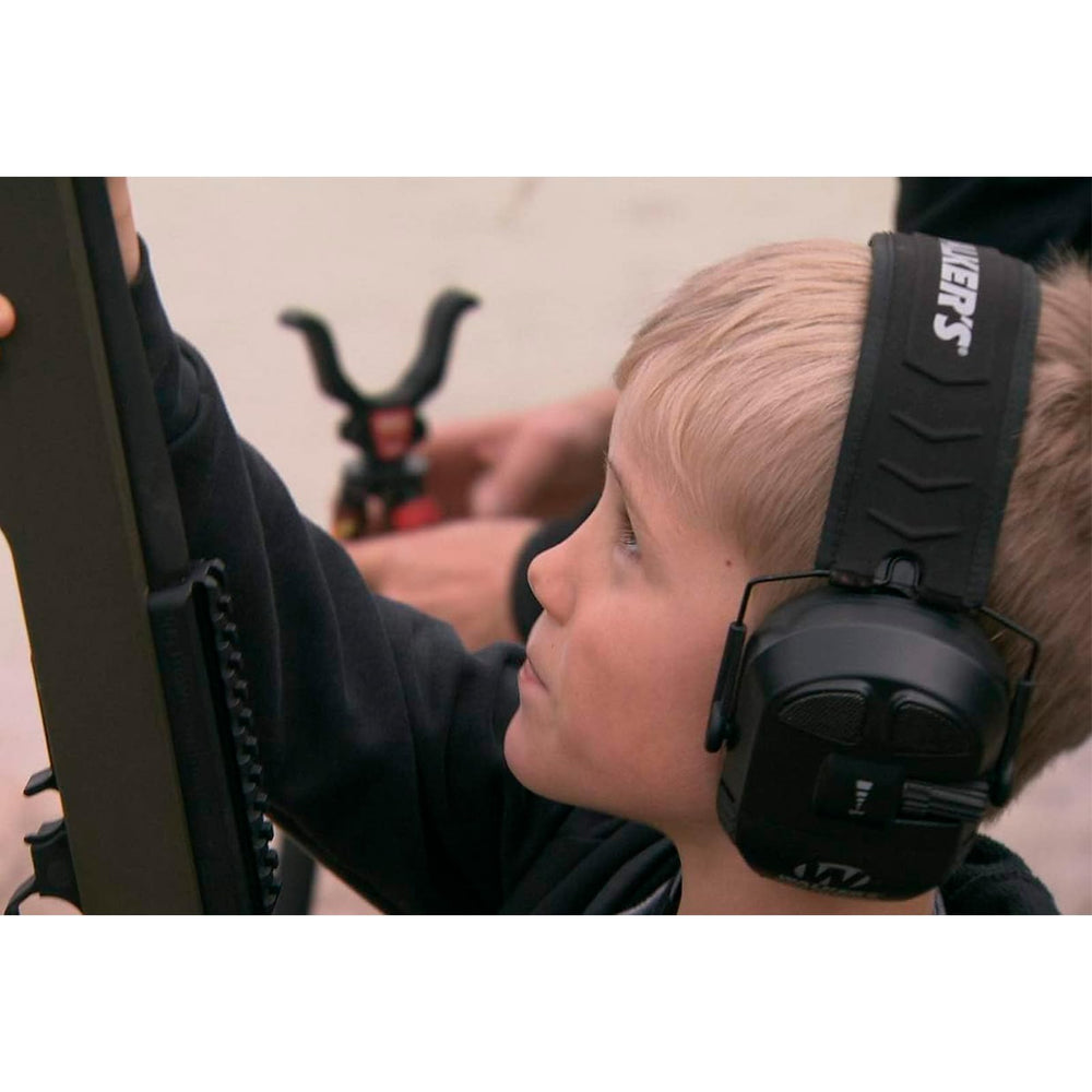 Walker's Ultimate Power Muff battery compartment open with 2 AAA batteries included.