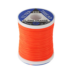 UTC Ultra Thread fluorescent fire orange spool; high visibility and strong grip for durable flies.