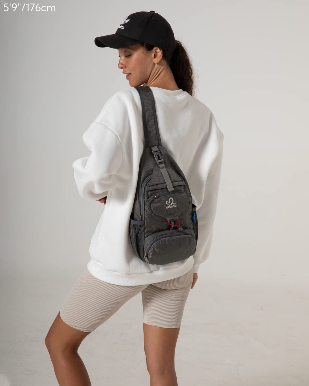Waterfall packable sling backpack gray side view showcasing compact profile.
