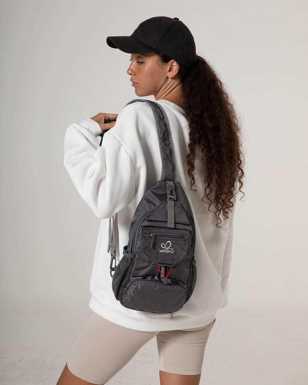 Waterfly Packable Sling Bag dimensions-expanded shows expanded capacity for essentials.