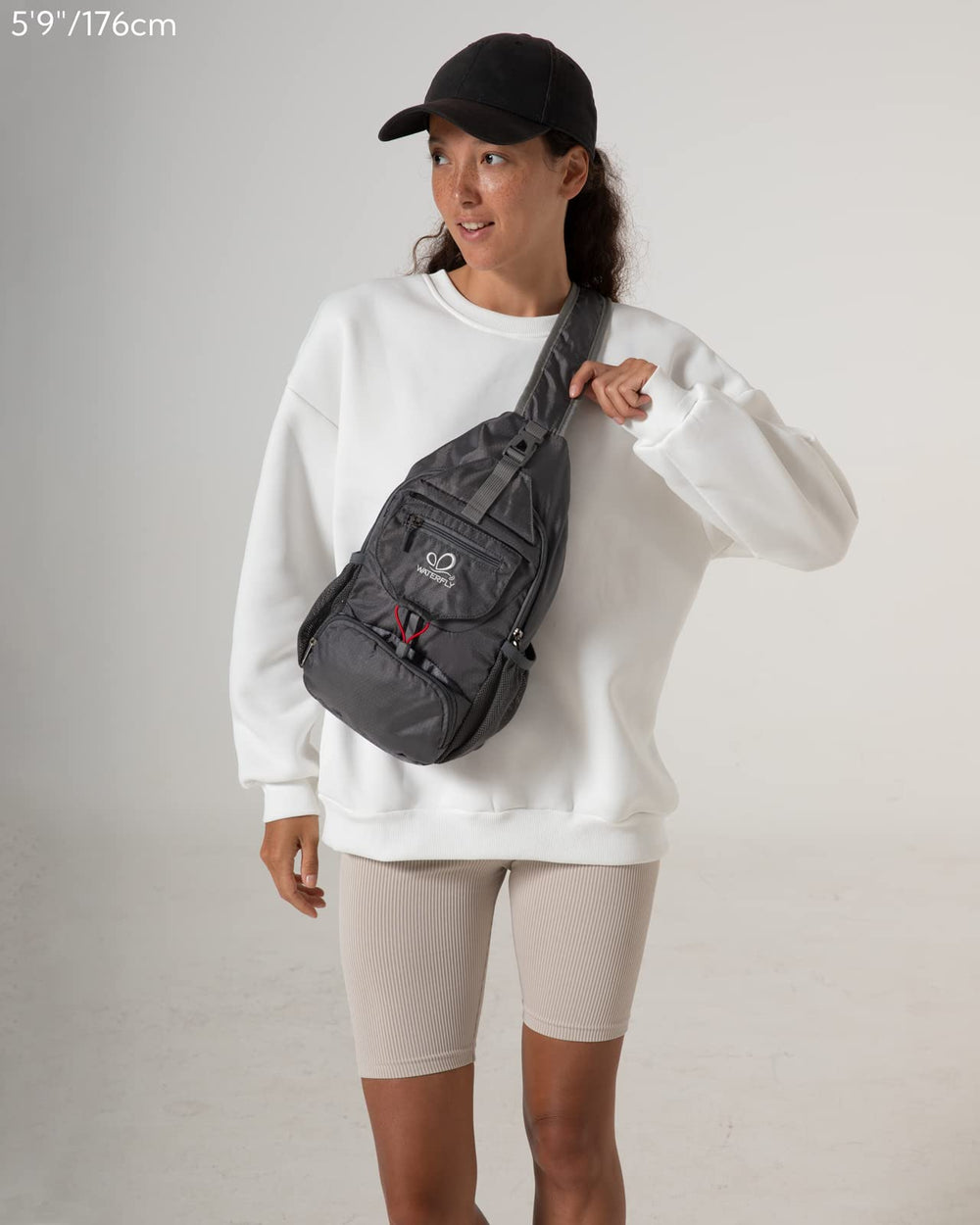 Waterfly Packable Sling Bag grey exterior demonstrates practical organization for quick access on the go.