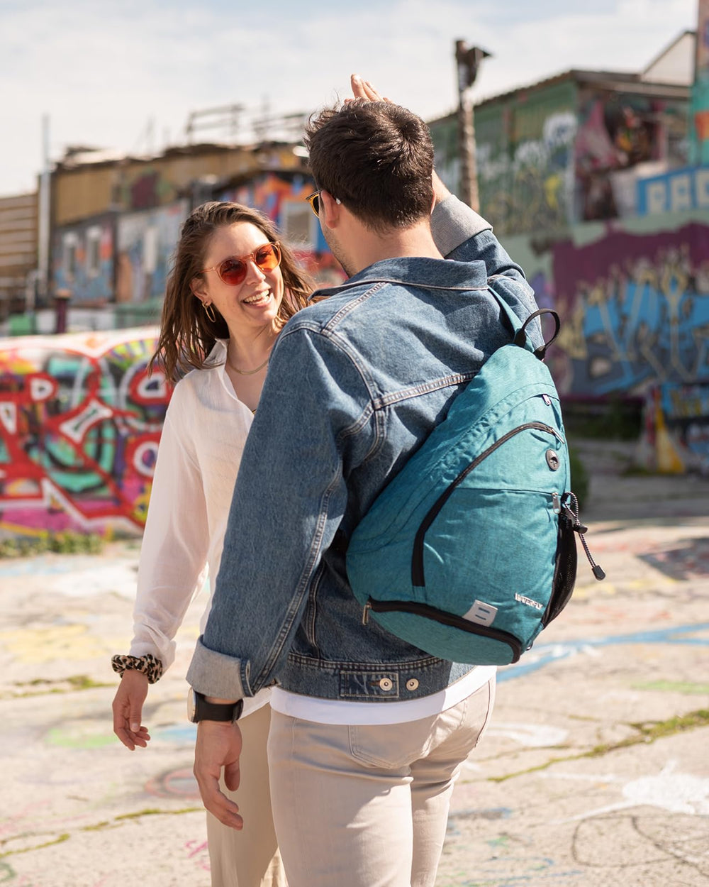 Waterfly sling bag back pocket secures valuables during travel