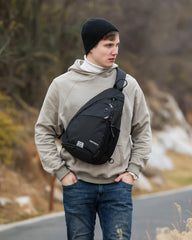 Waterfly Sling Bag outer pocket keeps essentials within quick reach during travel.