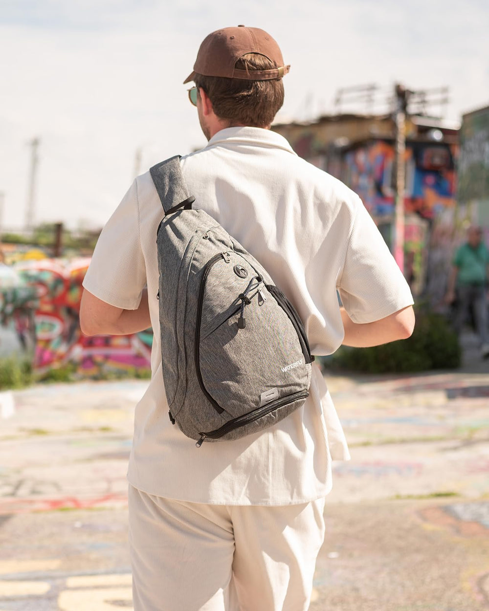 WATERFLY sling bag water-repellent linen-like fabric resists light moisture.