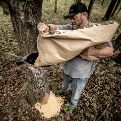 Weatherproof gravity bag feeder in action