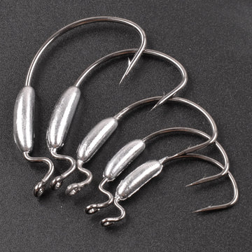 Angler rigging soft plastic worm on a weighted hook