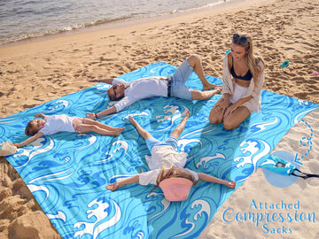 WEKAPO beach blanket with stakes demonstrates secure anchoring in breezy conditions.