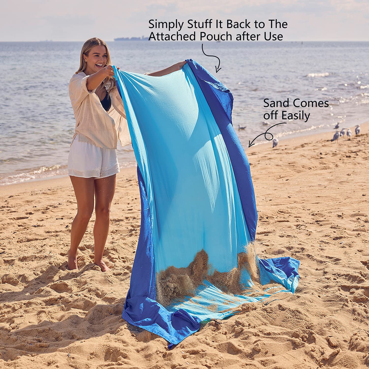WEKAPO blanket with 6 stakes secured for windy beach conditions