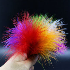 Close-up of WellieSTR dyed marabou feathers showing vibrant color hues for Woolly Bugger tails