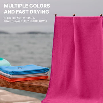 Wet Work lint-free microfiber towel removing sand at the beach.
